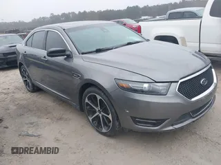 2014 Ford Taurus SHO with VIN 1FAHP2KT0EG171336, listed as a IAAI auction lot 41566688 with 154,328 mi miles. Bid and sale history available at carsss.com. Image 1.