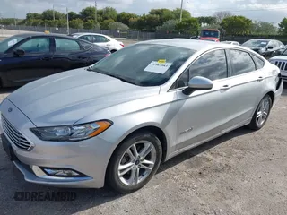 2018 Ford Fusion SE z VIN 3FA6P0LU2JR281231, wystawiony jako IAAI lot #41963083 z przebiegiem 115 434 mil mil oraz . Historia ofert i sprzedaży dostępna na DreamBid. Obrazek 2.
