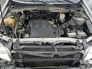 2005 Mazda Tribute LX with VIN 4F2YZ94185KM47932, listed as a Copart auction lot 63587744 with 203,178 mi miles and Salvage Title. Bid and sale history available at carsss.com. Image 12.
