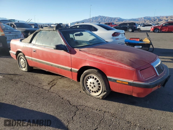 1989 Chrysler LeBaron z VIN 1C3XJ45K0KG251502, wystawiony jako Copart lot #87112404 z przebiegiem 166 445 mil mil oraz Tytuł czysty. Historia ofert i sprzedaży dostępna na DreamBid. Obrazek 4.