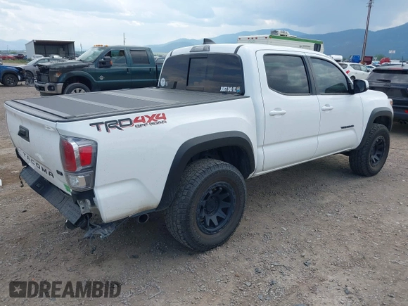 2022 Toyota Tacoma SR with VIN 3TMCZ5AN1NM478457, listed as a IAAI auction lot 42479107 with 59,547 mi miles and . Bid and sale history available at DreamBid. Image 4.