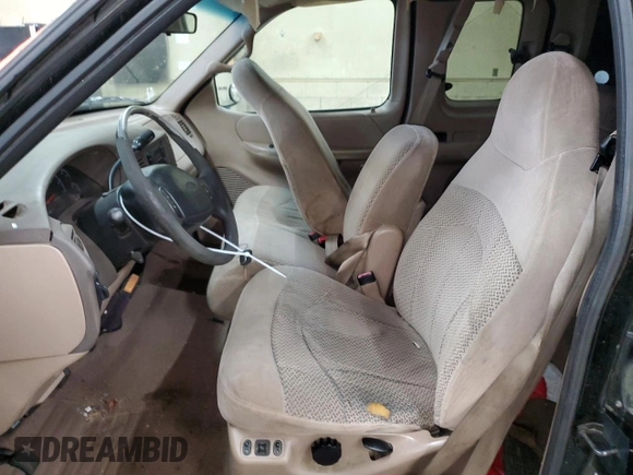 1999 Ford F-150 XL with VIN 1FTRX18L4XNB84248, listed as a Copart auction lot 52798555 with 204,943 mi miles and Salvage title. Bid and sale history available at DreamBid. Image 7.