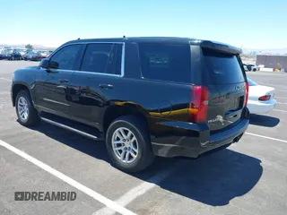 2015 Chevrolet Tahoe Commercial z VIN 1GNLC2EC0FR629983, wystawiony jako IAAI lot #42825604 z przebiegiem 112 410 mil mil oraz . Historia ofert i sprzedaży dostępna na DreamBid. Obrazek 3.