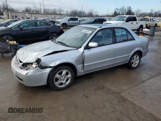2002 Mazda Protege DX with VIN JM1BJ225021594077, listed as a Copart auction lot 46692095 with 92,959 mi miles and Salvage Title. Bid and sale history available at DreamBid. Image 1.