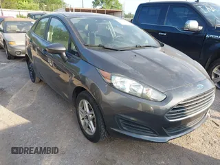 2017 Ford Fiesta SE z VIN 3FADP4BJ0HM157715, wystawiony jako IAAI lot #42304001 z przebiegiem 115 103 mil mil oraz . Historia ofert i sprzedaży dostępna na DreamBid. Obrazek 1.