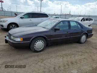 1992 Cadillac Seville z VIN 1G6KY53BXNU804126, wystawiony jako Copart lot #69219394 z przebiegiem 100 647 mil mil oraz Tytuł czysty. Historia ofert i sprzedaży dostępna na DreamBid. Obrazek 1.