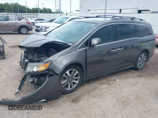 2015 Honda Odyssey Touring Elite with VIN 5FNRL5H99FB089642, listed as a IAAI auction lot 42591786 with 100,755 mi miles and . Bid and sale history available at DreamBid. Image 2.