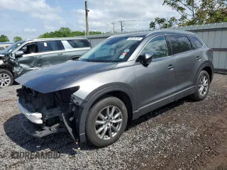 2019 Mazda CX-9 Touring z VIN JM3TCBCY0K0332807, wystawiony jako Copart lot #48678795 z przebiegiem 124 760 mil mil oraz Szkoda całkowita • Salvage title. Historia ofert i sprzedaży dostępna na DreamBid. Obrazek 1.