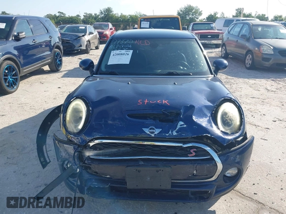 2016 MINI Cooper Hardtop 4 Door S with VIN WMWXU3C54G2D30766, listed as a IAAI auction lot 42008026 with 101,898 mi miles. Bid and sale history available at carsss.com. Image 12.