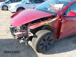 2024 Tesla Model Y Long Range with VIN 7SAYGDEE9RF199805, listed as a IAAI auction lot 42018221 with 7,359 mi miles. Bid and sale history available at carsss.com. Image 6.