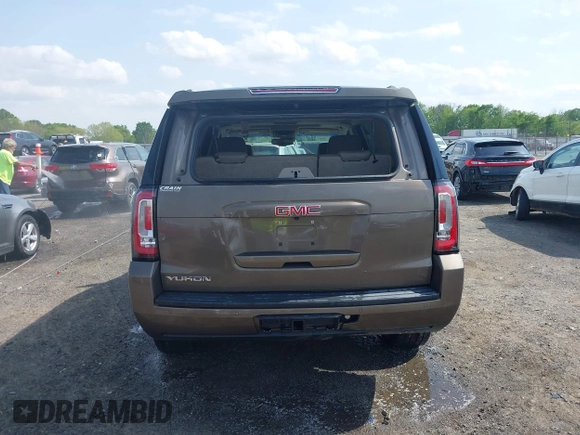 2016 GMC Yukon SLT with VIN 1GKS1BKC9GR328861, listed as a IAAI auction lot 42010839 with 200,711 mi miles. Bid and sale history available at carsss.com. Image 16.