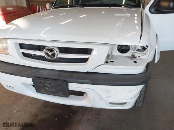 2002 Mazda B-Series 2WD Truck DS with VIN 4F4YR16V42TM25828, listed as a IAAI auction lot 41440414 with 132,334 mi miles. Bid and sale history available at carsss.com. Image 13.