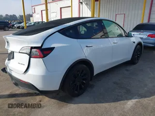 2023 Tesla Model Y Long Range with VIN 7SAYGAEE7PF766735, listed as a IAAI auction lot 41626651 with 21,983 mi miles. Bid and sale history available at carsss.com. Image 4.
