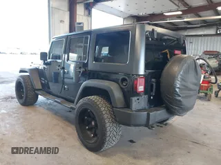 2012 Jeep Wrangler Unlimited Sport with VIN 1C4BJWDG8CL246829, listed as a IAAI auction lot 41816197 with 198,502 mi miles. Bid and sale history available at carsss.com. Image 3.