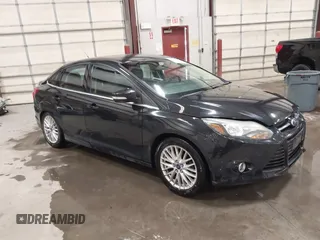 2014 Ford Focus Titanium with VIN 1FADP3J22EL199563, listed as a IAAI auction lot 41450106 with 129,271 mi miles. Bid and sale history available at carsss.com. Image 1.