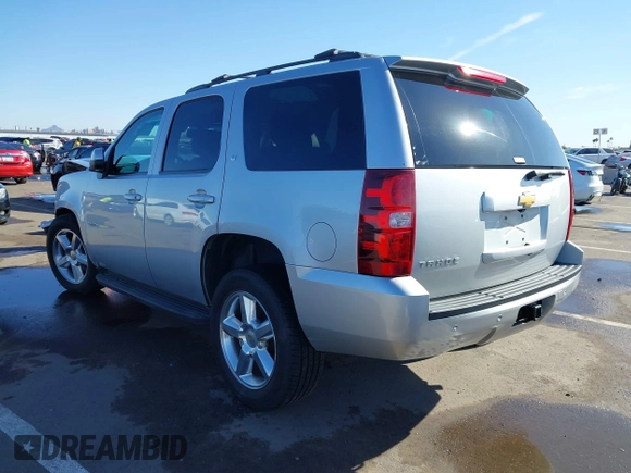 2013 Chevrolet Tahoe LT with VIN 1GNSKBE01DR157083, listed as a IAAI auction lot 41759189 with 153,403 mi miles and . Bid and sale history available at DreamBid. Image 3.