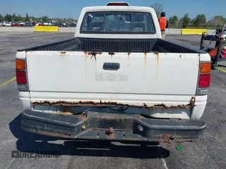 1994 Isuzu Pickup S z VIN JAACL11LXR7217702, wystawiony jako IAAI lot #41761090 z przebiegiem 198 468 mil mil oraz . Historia ofert i sprzedaży dostępna na DreamBid. Obrazek 6.