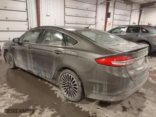 2018 Ford Fusion Hybrid Titanium with VIN 3FA6P0RU4JR147831, listed as a IAAI auction lot 41586033 with 101,088 mi miles. Bid and sale history available at carsss.com. Image 3.