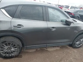 2017 Mazda CX-5 Touring with VIN JM3KFACL3H0148312, listed as a IAAI auction lot 41844634 with 68,534 mi miles and . Bid and sale history available at carsss.com. Image 13.