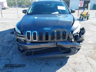 2016 Jeep Cherokee Altitude with VIN 1C4PJLCSXGW363598, listed as a IAAI auction lot 41670125 with 135,603 mi miles. Bid and sale history available at carsss.com. Image 6.
