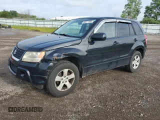2011 Suzuki Grand Vitara Premium z VIN JS3TD0D27B4100574, wystawiony jako Copart lot #60977285 z przebiegiem 159 068 mil mil oraz Szkoda całkowita • Salvage title. Historia ofert i sprzedaży dostępna na DreamBid. Obrazek 1.