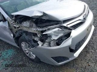 2014 Toyota Camry L with VIN 4T4BF1FK8ER419012, listed as a IAAI auction lot 41819331 with 84,372 mi miles and . Bid and sale history available at DreamBid. Image 6.