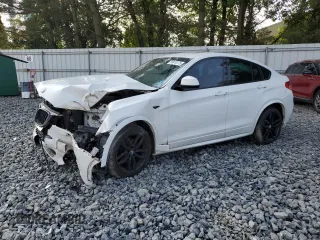2018 BMW X4 xDrive28i with VIN 5UXXW3C53J0Z60242, listed as a Copart auction lot 59410175 with 97,616 mi miles and Salvage title. Bid and sale history available at DreamBid. Image 1.