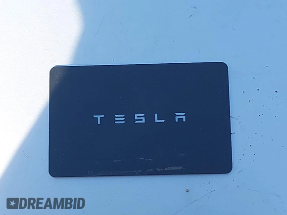 2018 Tesla Model 3 Long Range Battery with VIN 5YJ3E1EA0JF056979, listed as a IAAI auction lot 41865849 with 97,319 mi miles. Bid and sale history available at carsss.com. Image 11.