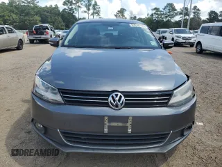 2014 Volkswagen Jetta TDI w/Premium with VIN 3VWLL7AJ4EM374570, listed as a Copart auction lot 63996195 with 186,497 mi miles and Salvage title. Bid and sale history available at DreamBid. Image 5.