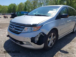 2012 Honda Odyssey Touring with VIN 5FNRL5H96CB043939, listed as a IAAI auction lot 41983643 with 202,535 mi miles. Bid and sale history available at carsss.com. Image 6.