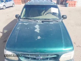 1999 Ford Explorer Sport with VIN 1FMYU22X2XUB19728, listed as a IAAI auction lot 41642358 with 128,788 mi miles and . Bid and sale history available at DreamBid. Image 6.