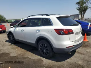 2015 Mazda CX-9 Grand Touring with VIN JM3TB3DA7F0454094, listed as a Copart auction lot 61757035 with 56,997 mi miles and Salvage title. Bid and sale history available at DreamBid. Image 2.