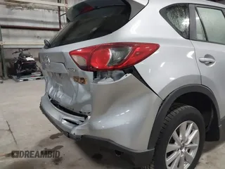 2016 Mazda CX-5 Sport with VIN JM3KE2BY2G0718434, listed as a IAAI auction lot 41961364 with 145,748 mi miles. Bid and sale history available at carsss.com. Image 6.