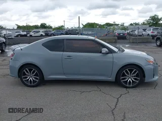 2014 Scion tC z VIN JTKJF5C71E3081033, wystawiony jako IAAI lot #42333111 z przebiegiem 144 124 mil mil oraz . Historia ofert i sprzedaży dostępna na DreamBid. Obrazek 13.