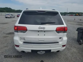 2017 Jeep Grand Cherokee Overland with VIN 1C4RJFCT7HC734125, listed as a Copart auction lot 54333215 with 101,229 mi miles and Salvage title. Bid and sale history available at DreamBid. Image 6.