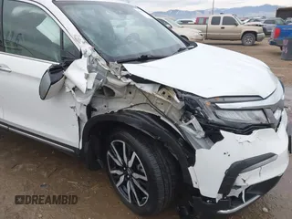 2021 Honda Pilot Elite with VIN 5FNYF6H03MB044154, listed as a IAAI auction lot 41050202 with 60,331 mi miles and . Bid and sale history available at DreamBid. Image 6.
