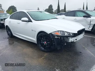 2015 Jaguar XF V6 Portfolio with VIN SAJWA0F70F8U62534, listed as a IAAI auction lot 41521097 with 112,117 mi miles. Bid and sale history available at carsss.com. Image 1.