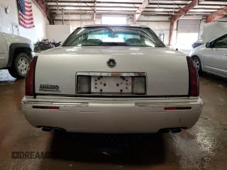 1999 Cadillac Eldorado z VIN 1G6EL12Y1XU611974, wystawiony jako Copart lot #71761494 z przebiegiem 139 494 mil mil oraz Czysty tytuł • Clean title. Historia ofert i sprzedaży dostępna na DreamBid. Obrazek 6.