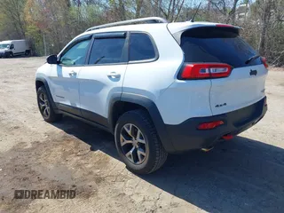 2014 Jeep Cherokee Trailhawk with VIN 1C4PJMBS8EW163212, listed as a IAAI auction lot 42124107 with 114,999 mi miles. Bid and sale history available at carsss.com. Image 3.