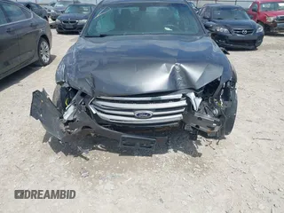 2015 Ford Taurus SEL with VIN 1FAHP2E81FG122378, listed as a IAAI auction lot 42081001 with 159,853 mi miles and . Bid and sale history available at carsss.com. Image 6.