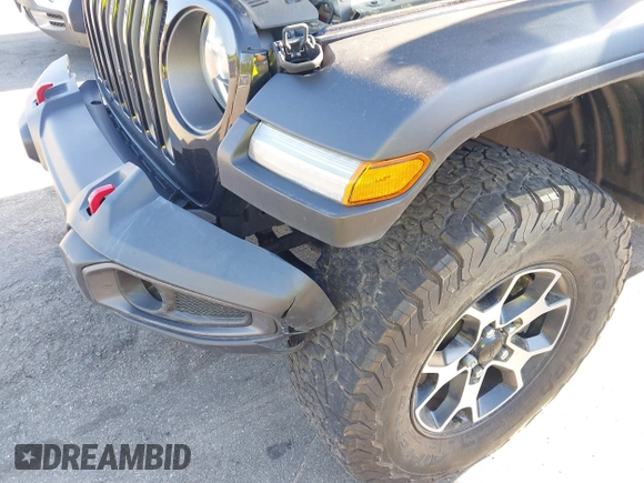2022 Jeep Wrangler Unlimited Rubicon with VIN 1C4HJXFNXNW149063, listed as a IAAI auction lot 42130171 with 33,961 mi miles and . Bid and sale history available at DreamBid. Image 6.