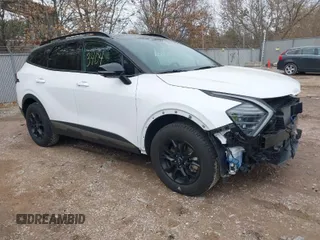 2023 Kia Sportage X-Pro Prestige z VIN 5XYK7CAF1PG071320, wystawiony jako IAAI lot #41863403 z przebiegiem 22 502 mil mil oraz . Historia ofert i sprzedaży dostępna na DreamBid. Obrazek 1.