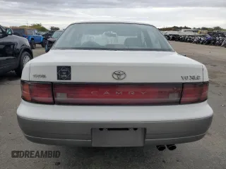 1994 Toyota Camry XLE with VIN JT2GK13E5R0008509, listed as a Copart auction lot 76014164 with 188,427 mi miles and Salvage Title. Bid and sale history available at carsss.com. Image 6.