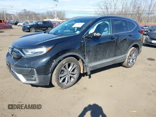 2020 Honda CR-V Touring with VIN 2HKRW2H98LH626651, listed as a IAAI auction lot 41668951 with 64,391 mi miles and . Bid and sale history available at DreamBid. Image 2.
