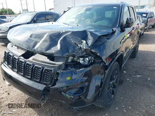 2021 Jeep Grand Cherokee Laredo E with VIN 1C4RJEAG0MC571375, listed as a IAAI auction lot 42087648 with 29,358 mi miles and . Bid and sale history available at DreamBid. Image 6.