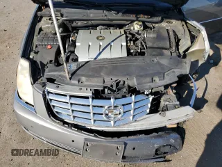 2006 Cadillac DTS 1SC z VIN 1G6KD57Y76U237062, wystawiony jako Copart lot #70920534 z przebiegiem 84 589 mil mil oraz Szkoda całkowita • Salvage title. Historia ofert i sprzedaży dostępna na DreamBid. Obrazek 13.