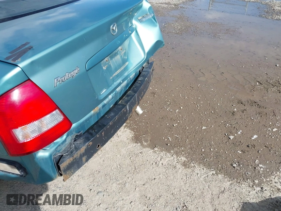 2002 Mazda Protege DX z VIN JM1BJ225721591435, wystawiony jako IAAI lot #42117544 z przebiegiem 191 185 mil mil oraz . Historia ofert i sprzedaży dostępna na DreamBid. Obrazek 15.