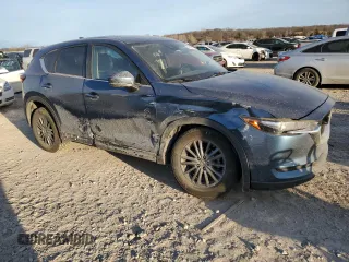 2020 Mazda CX-5 Touring with VIN JM3KFBCM9L0737243, listed as a Copart auction lot 46908495 with 76,956 mi miles and Salvage Title. Bid and sale history available at carsss.com. Image 4.