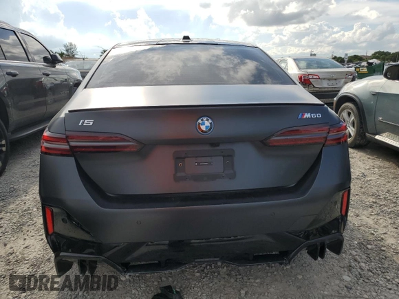 2024 BMW i5 M60 with VIN WBY43FK00RCR71826, listed as a Copart auction lot 72140144 with 5,987 mi miles and Salvage Title. Bid and sale history available at carsss.com. Image 6.
