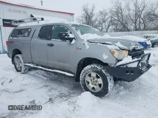 2010 Toyota Tundra 4WD Truck with VIN 5TFUY5F16AX145432, listed as a IAAI auction lot 41501609 with 232,688 mi miles. Bid and sale history available at carsss.com. Image 1.